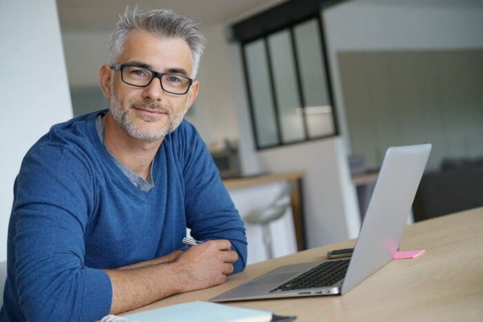 Middle age man at laptop