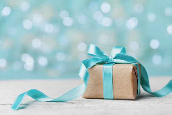 blue and kraft paper wrapped present